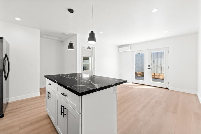 Open concept ADU interior with kitchen island and living space