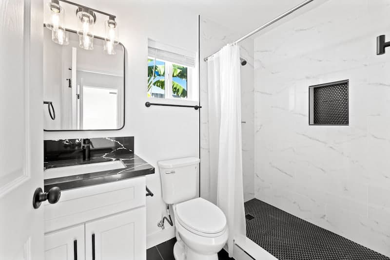 ADU bathroom with marble tile shower and modern finishes